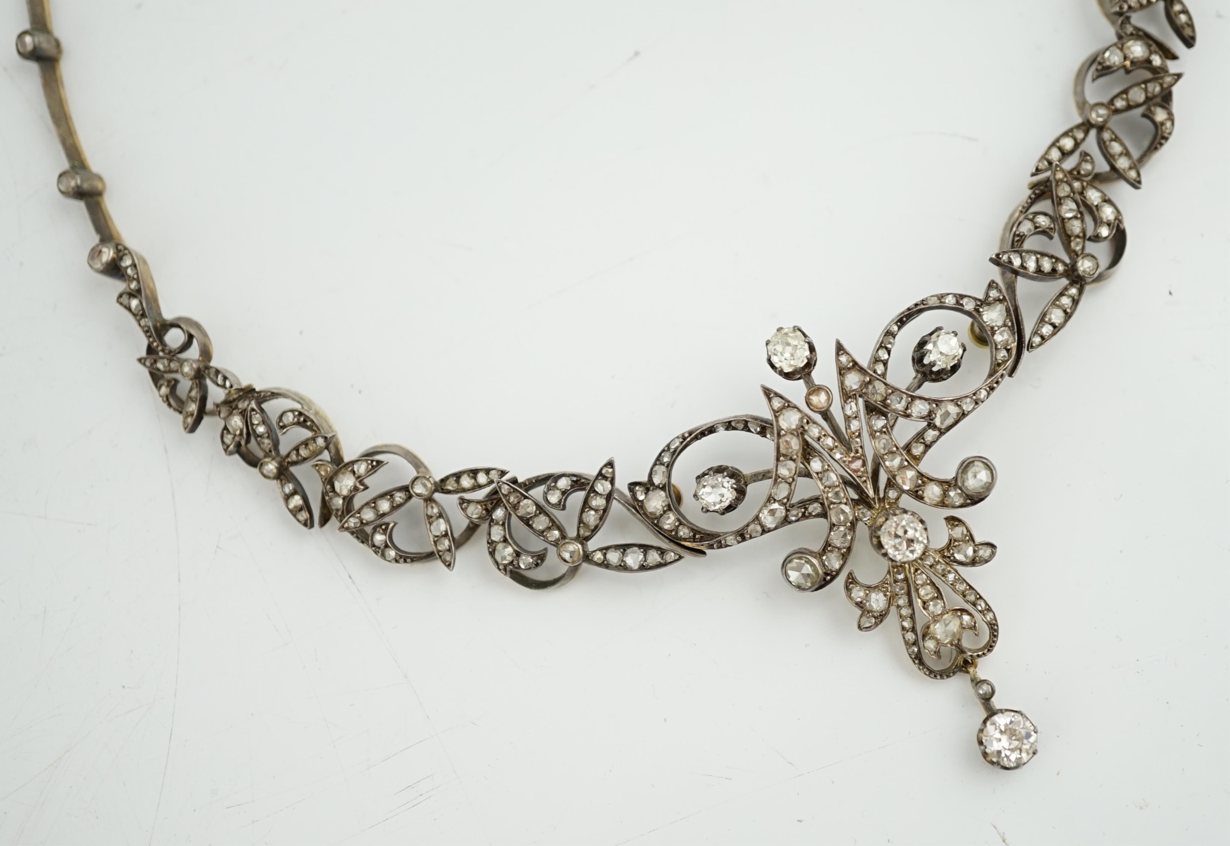 A late 19th/early 20th century French 18ct gold and silver, old mine and rose cut diamond cluster set tiara/necklace